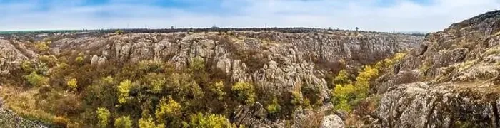 Framed Print : Aktovsky Canyon, Ukraine. Autumn trees and large stone boulders around Framed Print : Aktovsky Canyon, Ukraine. Autumn trees and large stone boulders around