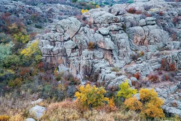 Framed Print : Aktovsky Canyon, Ukraine. Autumn trees and large stone boulders around Framed Print : Aktovsky Canyon, Ukraine. Autumn trees and large stone boulders around