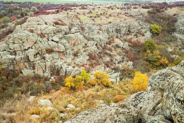 Framed Print : Aktovsky Canyon, Ukraine. Autumn trees and large stone boulders around Framed Print : Aktovsky Canyon, Ukraine. Autumn trees and large stone boulders around