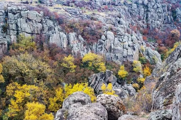 Framed Print : Aktovsky Canyon, Ukraine. Autumn trees and large stone boulders around Framed Print : Aktovsky Canyon, Ukraine. Autumn trees and large stone boulders around