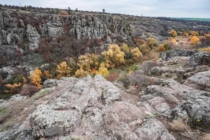 Framed Print : Aktovsky Canyon, Ukraine. Autumn trees and large stone boulders around Framed Print : Aktovsky Canyon, Ukraine. Autumn trees and large stone boulders around