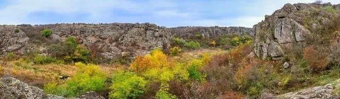 Framed Print : Aktovsky Canyon, Ukraine. Autumn trees and large stone boulders around Framed Print : Aktovsky Canyon, Ukraine. Autumn trees and large stone boulders around