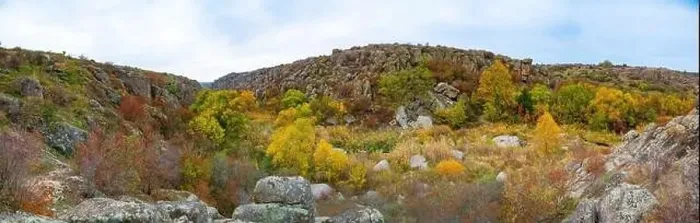 Framed Print : Aktovsky Canyon, Ukraine. Autumn trees and large stone boulders around Framed Print : Aktovsky Canyon, Ukraine. Autumn trees and large stone boulders around