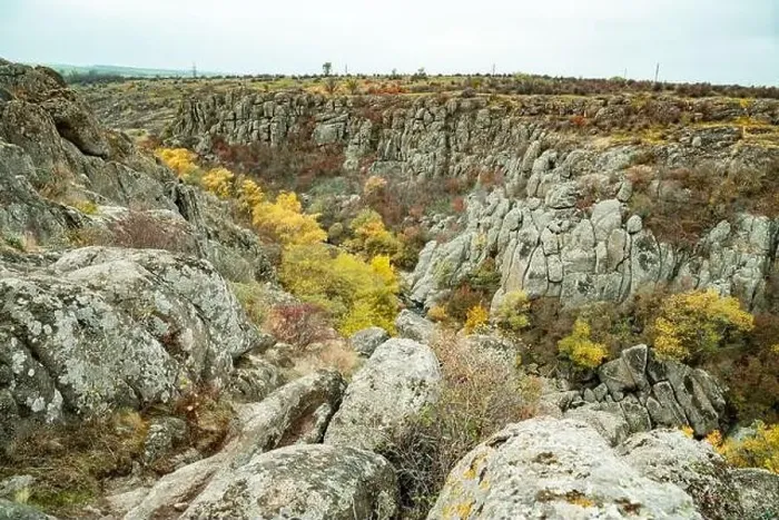 Framed Print : Aktovsky Canyon, Ukraine. Autumn trees and large stone boulders around Framed Print : Aktovsky Canyon, Ukraine. Autumn trees and large stone boulders around
