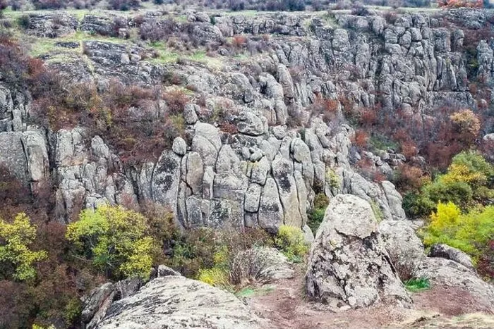 Framed Print : Aktovsky Canyon, Ukraine. Autumn trees and large stone boulders around Framed Print : Aktovsky Canyon, Ukraine. Autumn trees and large stone boulders around