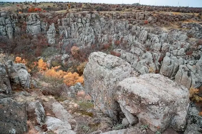 Framed Print : Aktovsky Canyon, Ukraine. Autumn trees and large stone boulders around Framed Print : Aktovsky Canyon, Ukraine. Autumn trees and large stone boulders around