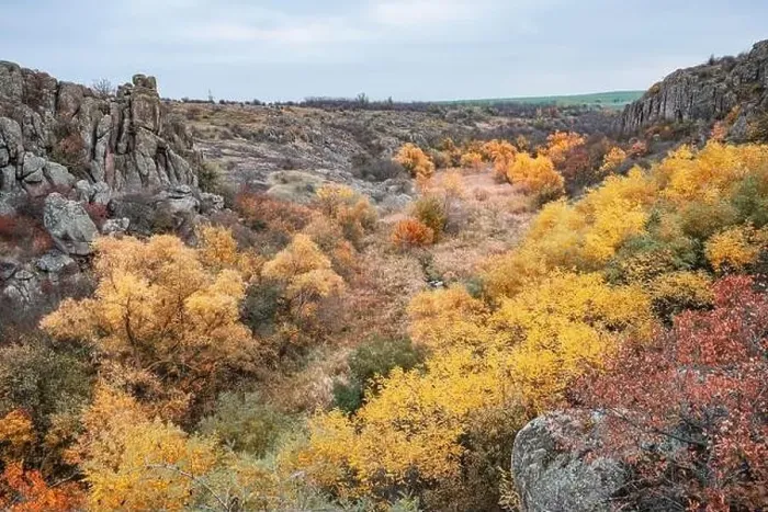 Framed Print : Aktovsky Canyon, Ukraine. Autumn trees and large stone boulders around Framed Print : Aktovsky Canyon, Ukraine. Autumn trees and large stone boulders around