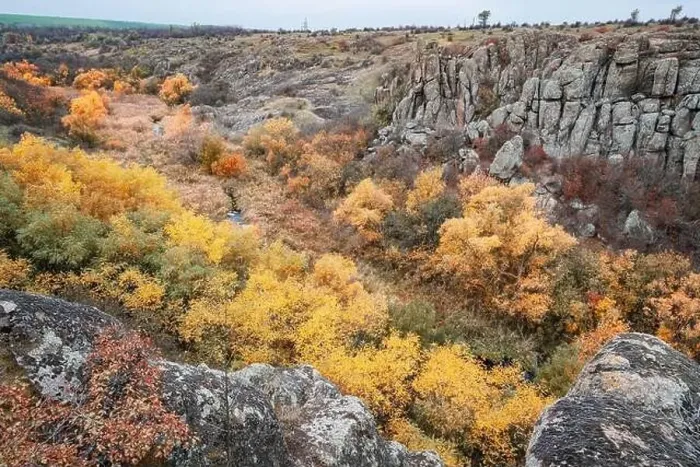 Framed Print : Aktovsky Canyon, Ukraine. Autumn trees and large stone boulders around Framed Print : Aktovsky Canyon, Ukraine. Autumn trees and large stone boulders around