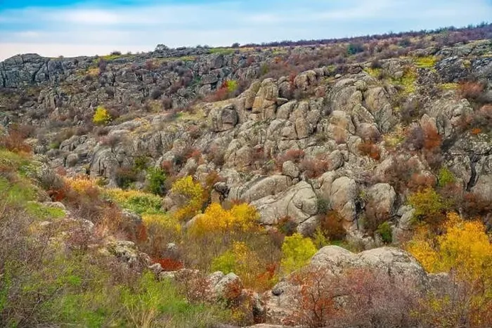 Framed Print : Aktovsky Canyon, Ukraine. Autumn trees and large stone boulders around Framed Print : Aktovsky Canyon, Ukraine. Autumn trees and large stone boulders around