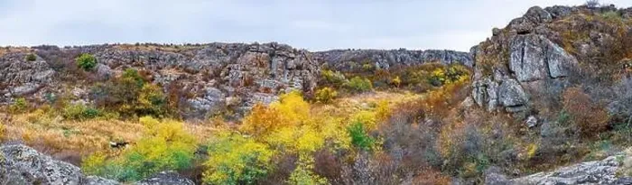 Framed Print : Aktovsky Canyon, Ukraine. Autumn trees and large stone boulders around Framed Print : Aktovsky Canyon, Ukraine. Autumn trees and large stone boulders around