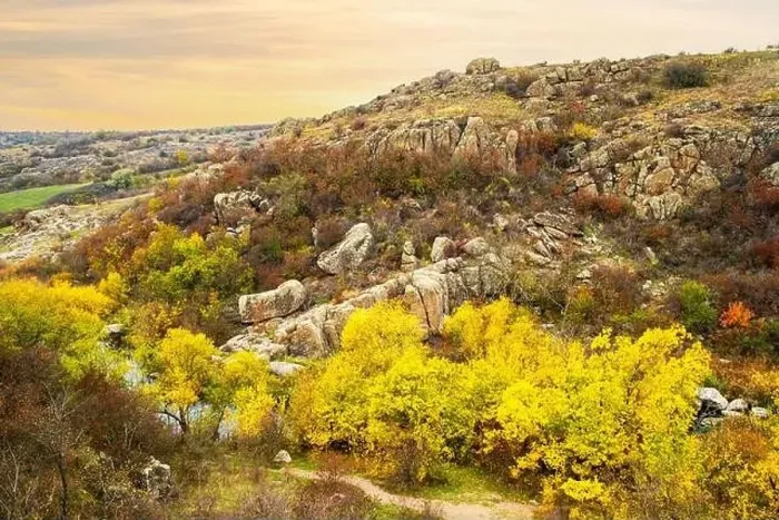 Framed Print : Aktovsky Canyon, Ukraine. Autumn trees and large stone boulders around Framed Print : Aktovsky Canyon, Ukraine. Autumn trees and large stone boulders around