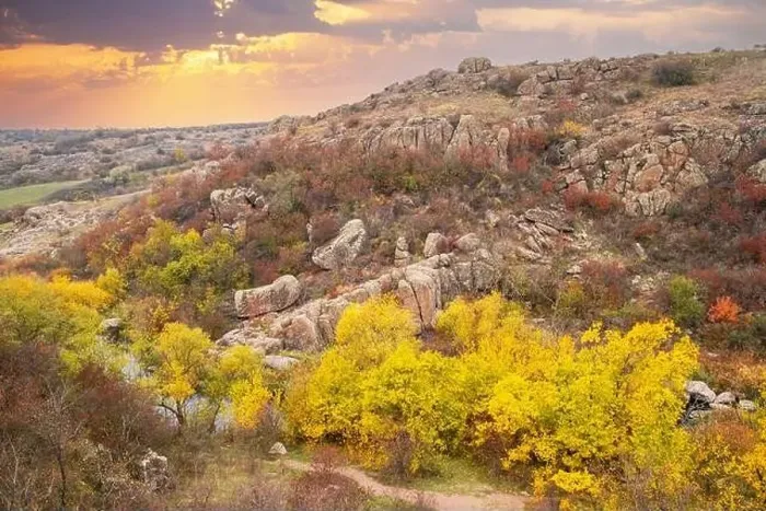 Framed Print : Aktovsky Canyon, Ukraine. Autumn trees and large stone boulders around Framed Print : Aktovsky Canyon, Ukraine. Autumn trees and large stone boulders around