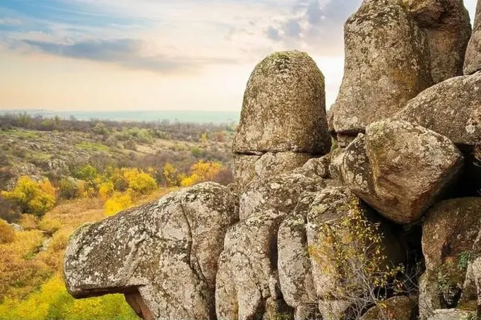 Framed Print : Aktovsky Canyon, Ukraine. Autumn trees and large stone boulders around Framed Print : Aktovsky Canyon, Ukraine. Autumn trees and large stone boulders around