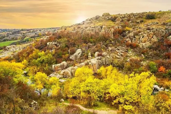 Framed Print : Aktovsky Canyon, Ukraine. Autumn trees and large stone boulders around Framed Print : Aktovsky Canyon, Ukraine. Autumn trees and large stone boulders around