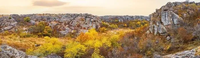 Framed Print : Aktovsky Canyon, Ukraine. Autumn trees and large stone boulders around Framed Print : Aktovsky Canyon, Ukraine. Autumn trees and large stone boulders around