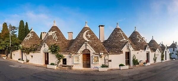 ALBEROBELLO, ITALY - OCTOBER 10, 2022: Trullo houses with the traditional symbols