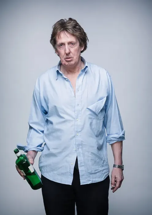 Framed Print : Alcoholic middle aged professional man following a fight, holding spirits bottle Framed Print : Alcoholic middle aged professional man following a fight, holding spirits bottle