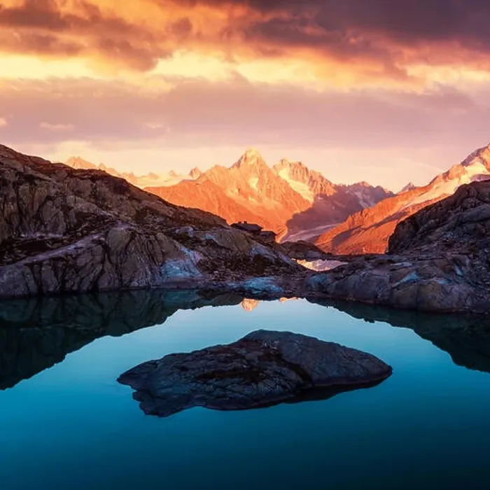 Framed Print : Alpine mountain landscape with lake and peaks covered by snow on sunset time Framed Print : Alpine mountain landscape with lake and peaks covered by snow on sunset time