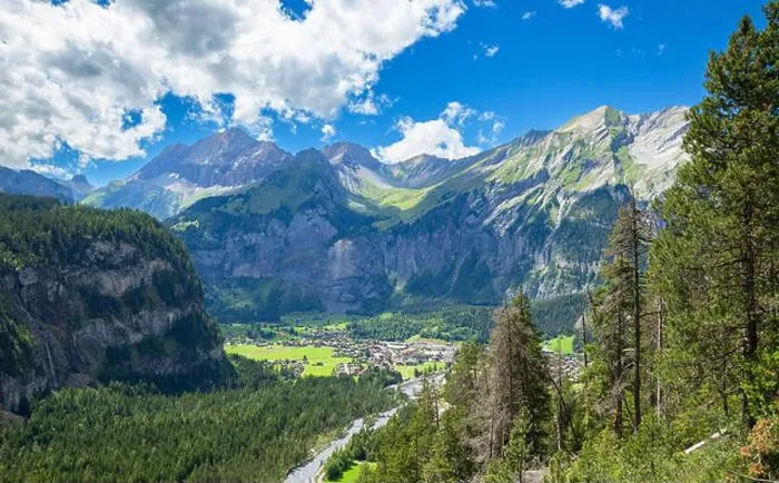 Framed Print : Alpine mountain and village view in Kandersteg, Switzerland, sunny landscape Framed Print : Alpine mountain and village view in Kandersteg, Switzerland, sunny landscape