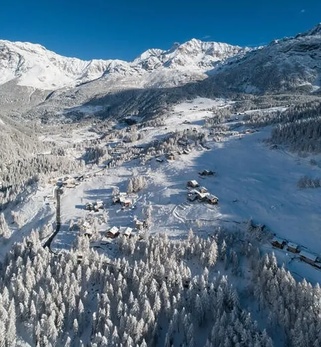 Framed Print : Alpine village and forest in winter, aerial view on the Alps Framed Print : Alpine village and forest in winter, aerial view on the Alps