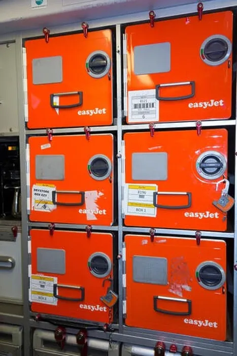 Framed Print : Aluminium food / meal storage locker / lockers / box / canister boxes in the galley on an easyet Airbus A320 or A319 aircraft during a short haul Framed Print : Aluminium food / meal storage locker / lockers / box / canister boxes in the galley on an easyet Airbus A320 or A319 aircraft during a short haul