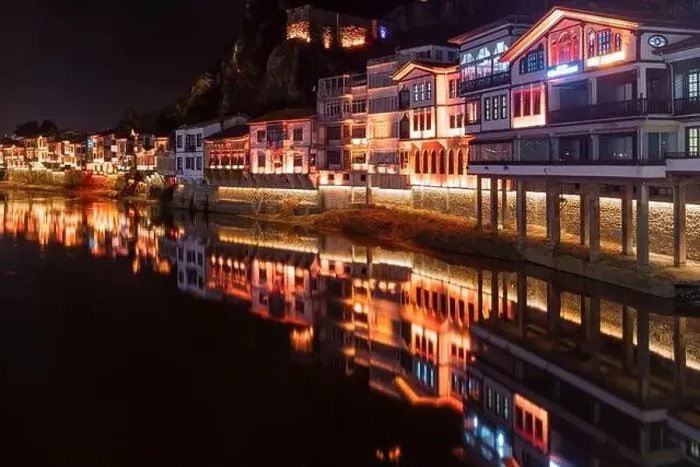 Framed Print : Amasya, Turkey - December 22, 2022 : Old Ottoman houses and clock tower view by the Yesilirmak River in Amasya City Framed Print : Amasya, Turkey - December 22, 2022 : Old Ottoman houses and clock tower view by the Yesilirmak River in Amasya City