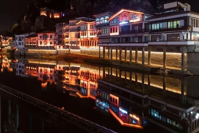 Framed Print : Amasya, Turkey - December 22, 2022 : Old Ottoman houses and clock tower view by the Yesilirmak River in Amasya City Framed Print : Amasya, Turkey - December 22, 2022 : Old Ottoman houses and clock tower view by the Yesilirmak River in Amasya City