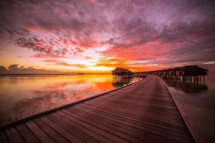 Framed Print : Amazing abstract background. Beautiful sunset colors in Maldives. Long jetty and luxury overwater villas Framed Print : Amazing abstract background. Beautiful sunset colors in Maldives. Long jetty and luxury overwater villas