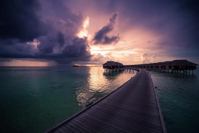 Framed Print : Amazing abstract background. Beautiful sunset colors in Maldives. Long jetty and luxury overwater villas Framed Print : Amazing abstract background. Beautiful sunset colors in Maldives. Long jetty and luxury overwater villas
