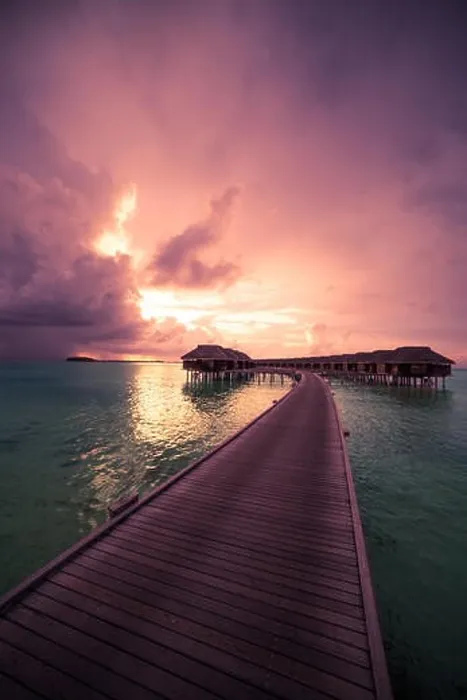 Framed Print : Amazing abstract background. Beautiful sunset colors in Maldives. Long jetty and luxury overwater villas Framed Print : Amazing abstract background. Beautiful sunset colors in Maldives. Long jetty and luxury overwater villas