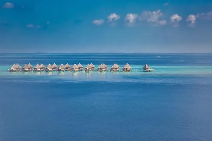Framed Print : Amazing aerial landscape, luxury tropical resort or hotel with water villas and beautiful beach scenery. Perfect bird eyes view in Maldives, landscape Framed Print : Amazing aerial landscape, luxury tropical resort or hotel with water villas and beautiful beach scenery. Perfect bird eyes view in Maldives, landscape