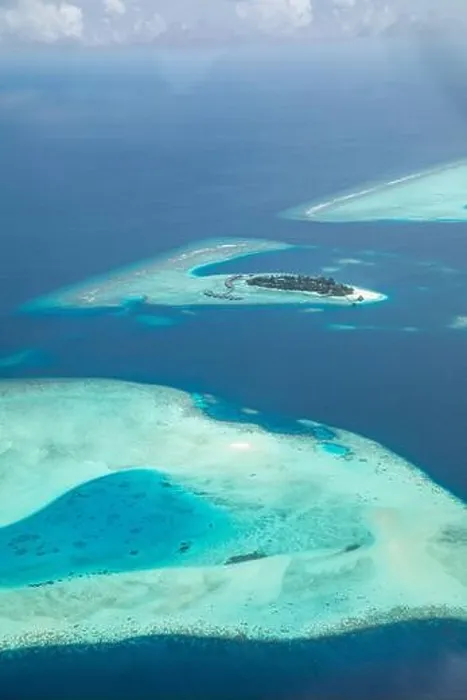 Framed Print : Amazing bird eyes view in Maldives from plane or drone. Luxury resort hotel water villas bungalows. Summer vacation holiday landscape destination Framed Print : Amazing bird eyes view in Maldives from plane or drone. Luxury resort hotel water villas bungalows. Summer vacation holiday landscape destination
