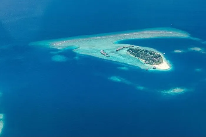Framed Print : Amazing bird eyes view in Maldives from plane or drone. Luxury resort hotel water villas bungalows. Summer vacation holiday landscape destination Framed Print : Amazing bird eyes view in Maldives from plane or drone. Luxury resort hotel water villas bungalows. Summer vacation holiday landscape destination