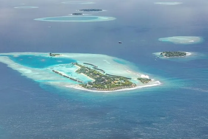 Framed Print : Amazing bird eyes view in Maldives from plane or drone. Luxury resort hotel water villas bungalows. Summer vacation holiday landscape destination Framed Print : Amazing bird eyes view in Maldives from plane or drone. Luxury resort hotel water villas bungalows. Summer vacation holiday landscape destination
