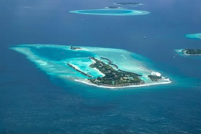 Framed Print : Amazing bird eyes view in Maldives from plane or drone. Luxury resort hotel water villas bungalows. Summer vacation holiday landscape destination