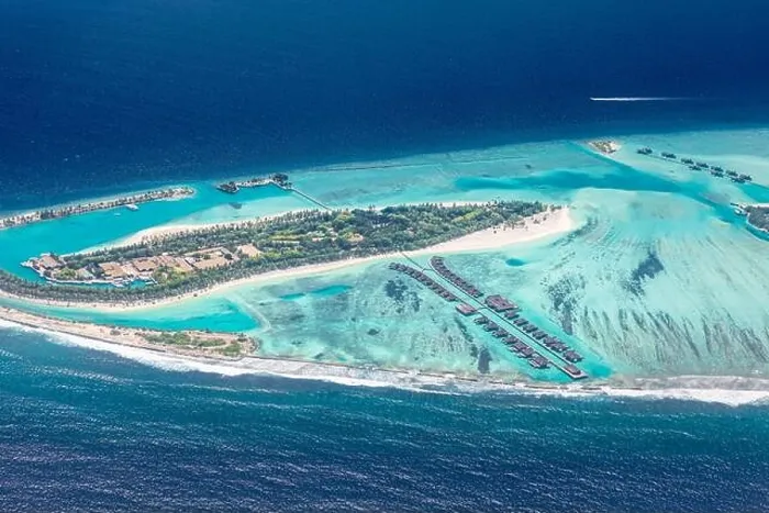 Framed Print : Amazing bird eyes view in Maldives from plane or drone. Luxury resort hotel water villas bungalows. Summer vacation holiday landscape destination