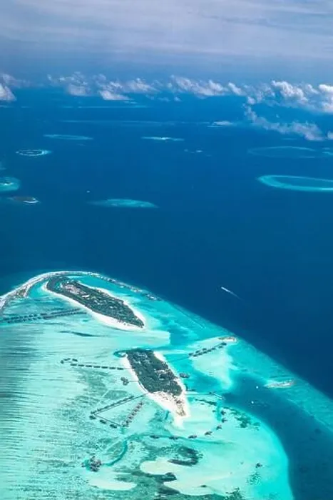 Framed Print : Amazing bird eyes view in Maldives from plane or drone. Luxury resort hotel water villas bungalows. Summer vacation holiday landscape destination Framed Print : Amazing bird eyes view in Maldives from plane or drone. Luxury resort hotel water villas bungalows. Summer vacation holiday landscape destination