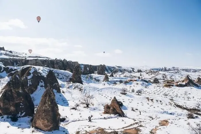 Framed Print : Amazing drone view of colorful hot air balloons flying over old Uchisar settlement Framed Print : Amazing drone view of colorful hot air balloons flying over old Uchisar settlement