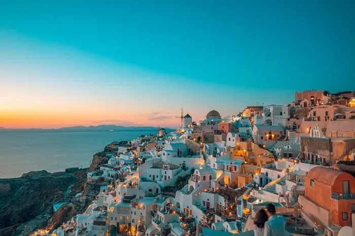 Framed Print : Amazing evening view of Santorini island. Picturesque spring sunset on the famous Oia village, Greece, Europe. Traveling concept background. Artistic Framed Print : Amazing evening view of Santorini island. Picturesque spring sunset on the famous Oia village, Greece, Europe. Traveling concept background. Artistic