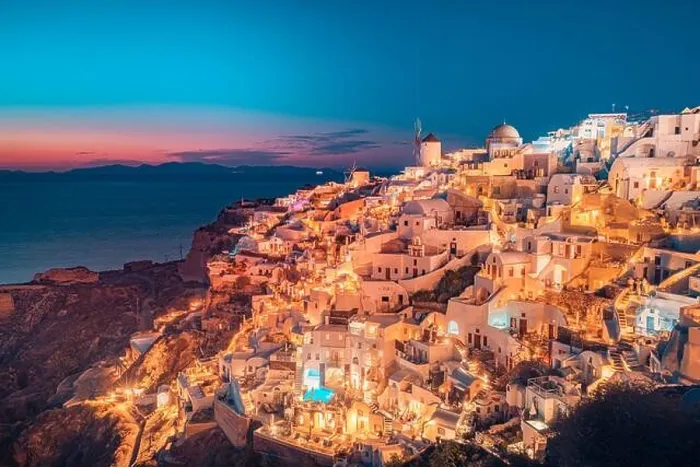 Framed Print : Amazing evening view of Santorini island. Picturesque spring sunset on the famous Oia village, Greece, Europe. Traveling concept background. Artistic Framed Print : Amazing evening view of Santorini island. Picturesque spring sunset on the famous Oia village, Greece, Europe. Traveling concept background. Artistic