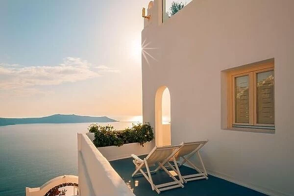 Amazing evening view over white architecture and romantic sunset light, Santorini, summer romance, honeymoon destination. Traveling concept, vacation