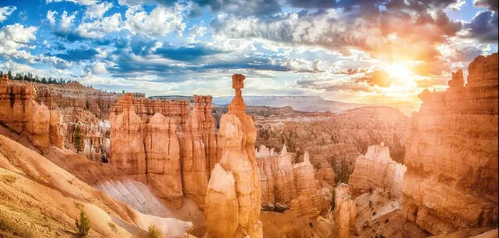 Framed Print : Amazing hoodoos sandstone formations in Bryce Canyon National Park in golden morning light at sunrise with dramatic Framed Print : Amazing hoodoos sandstone formations in Bryce Canyon National Park in golden morning light at sunrise with dramatic