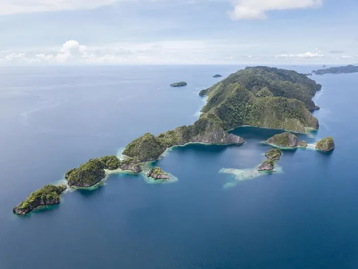 Framed Print : Amazing limestone islands rise from the calm seascape around Misool, Raja Ampat, Indonesia. This tropical region harbors amazing marine biodiversity Framed Print : Amazing limestone islands rise from the calm seascape around Misool, Raja Ampat, Indonesia. This tropical region harbors amazing marine biodiversity