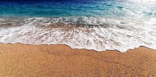 Amazing Mediterranean seascape with golden sand and blue waves. Summer vacations background