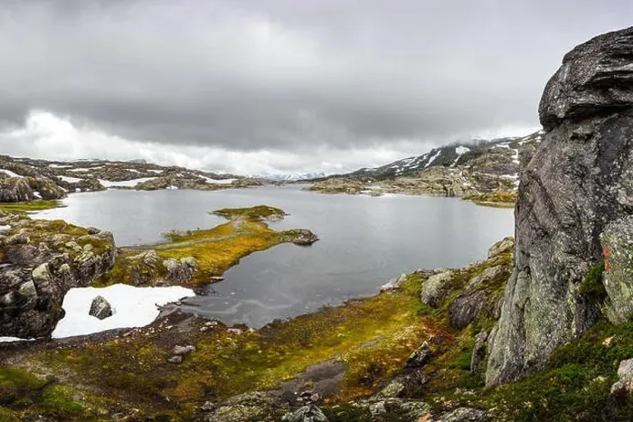 Framed Print : Amazing norwegian landscape with clear lake and snowy mountains