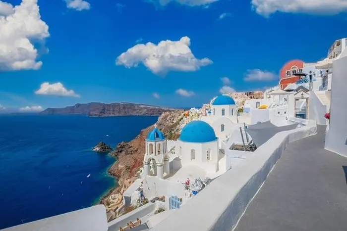 Framed Print : Amazing panoramic landscape, luxury travel vacation. Oia town on Santorini island, Greece. Traditional and famous houses and churches with blue domes Framed Print : Amazing panoramic landscape, luxury travel vacation. Oia town on Santorini island, Greece. Traditional and famous houses and churches with blue domes