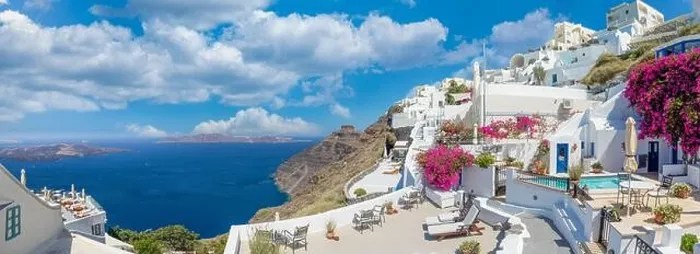 Framed Print : Amazing panoramic landscape, luxury travel vacation. Oia town on Santorini island, Greece. Traditional and famous white architecture and pink flowers Framed Print : Amazing panoramic landscape, luxury travel vacation. Oia town on Santorini island, Greece. Traditional and famous white architecture and pink flowers