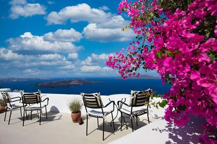 Framed Print : Amazing panoramic landscape, luxury travel vacation. Oia town on Santorini island, Greece. Traditional and famous white architecture and pink flowers Framed Print : Amazing panoramic landscape, luxury travel vacation. Oia town on Santorini island, Greece. Traditional and famous white architecture and pink flowers