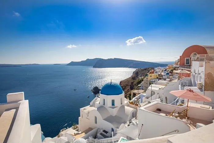 Framed Print : Amazing panoramic landscape, luxury travel vacation. Oia town on Santorini island, Greece. Traditional and famous houses and churches with blue domes Framed Print : Amazing panoramic landscape, luxury travel vacation. Oia town on Santorini island, Greece. Traditional and famous houses and churches with blue domes