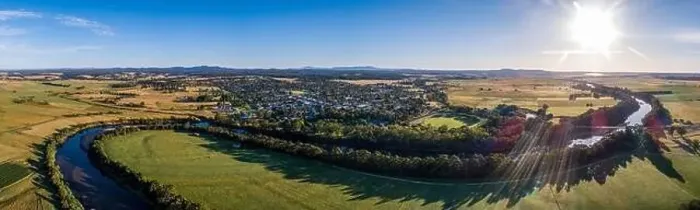 Framed Print : Amazing river bends among green fields and small town in Australian outback at sunset - wide aerial panorama Framed Print : Amazing river bends among green fields and small town in Australian outback at sunset - wide aerial panorama